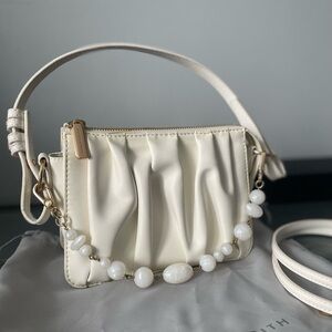Elegant Cream Handbag with Beaded Strap